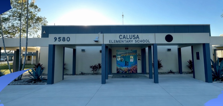 The sunny front entrance of Calusa Elementary School at 9580 West Calusa Club Drive